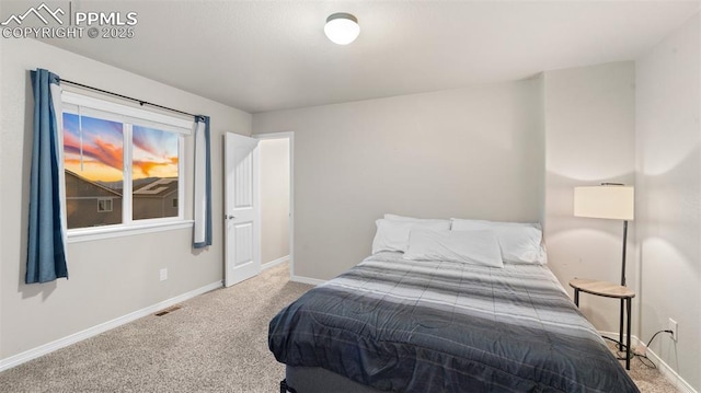 bedroom featuring carpet, baseboards, and visible vents