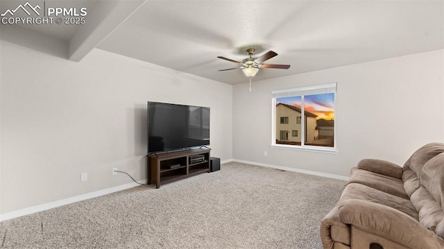 carpeted living area featuring baseboards and ceiling fan