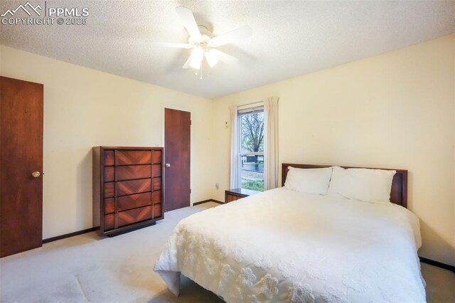 3314 Valley Hi Ave Unit B, Colorado Springs, CO 80910 - carpeted bedroom featuring ceiling fan, a textured ceiling, and baseboards