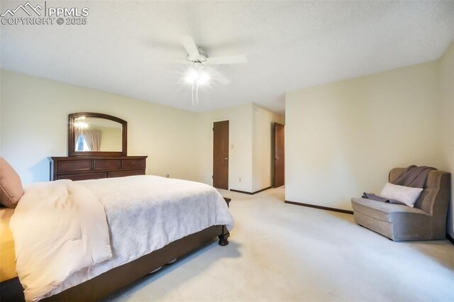 3314 Valley Hi Ave Unit B, Colorado Springs, CO 80910 - bedroom with light carpet, ceiling fan, and baseboards