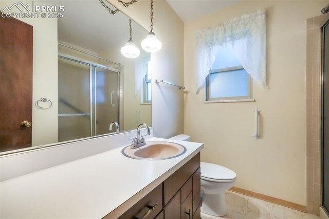 3314 Valley Hi Ave Unit B, Colorado Springs, CO 80910 - bathroom featuring a shower stall, toilet, vanity, and baseboards