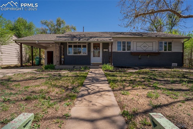 103 Linden Dr, Colorado Springs, CO 80911 - ranch-style house featuring an attached carport, concrete driveway, and covered porch