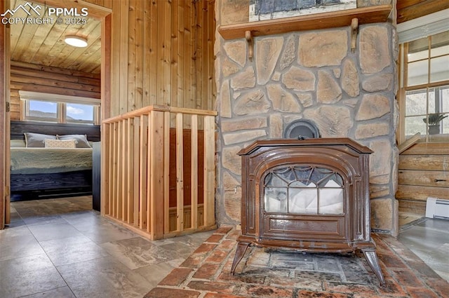 3645 Doolittle Rd, Monument, CO 80132 - detailed view of wooden walls, baseboard heating, and wooden ceiling