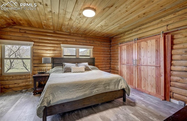 3645 Doolittle Rd, Monument, CO 80132 - bedroom featuring rustic walls, multiple windows, wooden ceiling, and hardwood / wood-style flooring