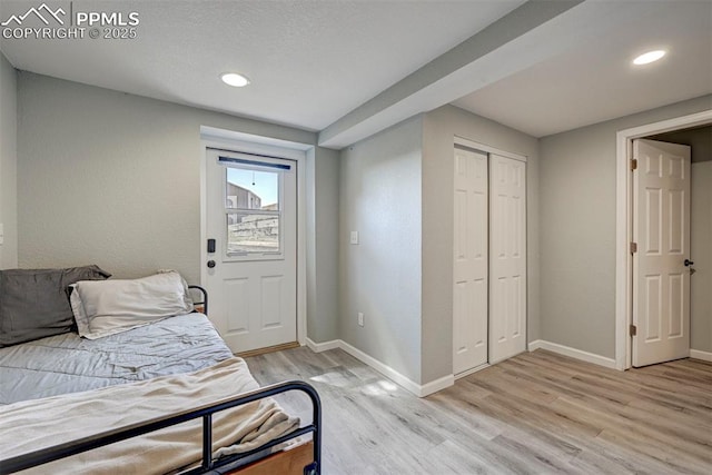 3645 Doolittle Rd, Monument, CO 80132 - bedroom with light wood-style flooring, baseboards, recessed lighting, and a closet