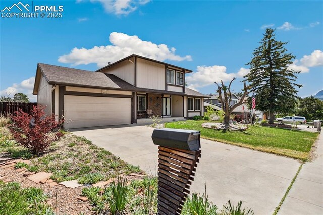 view of front of house featuring a garage, concrete driveway, and covered porch