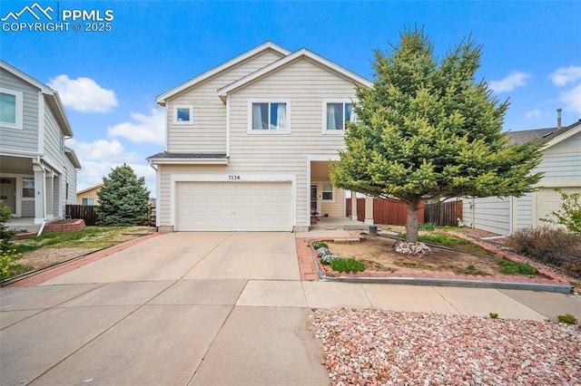 7136 Purple Thistle Ct, Colorado Springs, CO 80922 - traditional home with an attached garage, concrete driveway, and fence