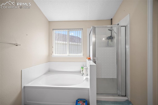 7136 Purple Thistle Ct, Colorado Springs, CO 80922 - full bath featuring a bath, a stall shower, and a textured ceiling