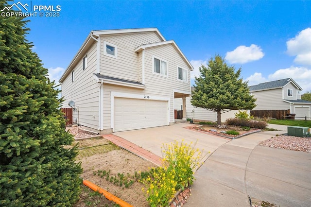 7136 Purple Thistle Ct, Colorado Springs, CO 80922 - traditional home featuring driveway, a garage, and fence