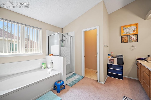 7136 Purple Thistle Ct, Colorado Springs, CO 80922 - bathroom with carpet flooring, a stall shower, a bath, vaulted ceiling, and vanity