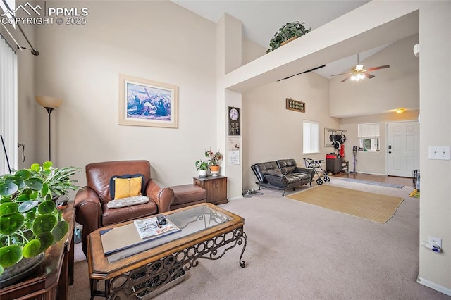 7136 Purple Thistle Ct, Colorado Springs, CO 80922 - living room featuring carpet floors, a ceiling fan, high vaulted ceiling, and baseboards