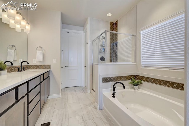 full bathroom featuring a garden tub, a stall shower, vanity, marble finish flooring, and recessed lighting