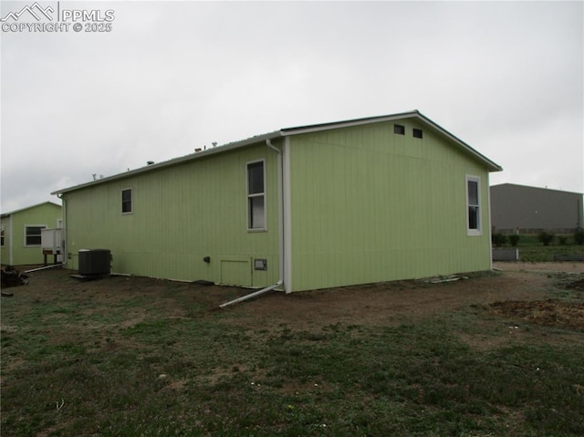 view of side of property featuring central AC unit