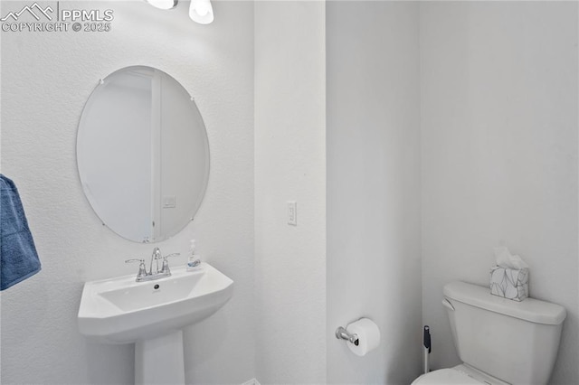 16422 Mountain Flax Dr, Monument, CO 80132 - half bathroom with toilet and a sink