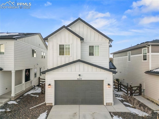 16422 Mountain Flax Dr, Monument, CO 80132 - view of front of property with board and batten siding, an attached garage, and driveway