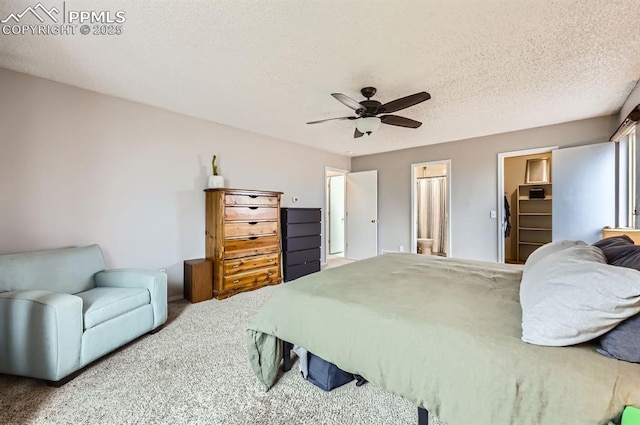4258 Grassy Ct, Colorado Springs, CO 80916 - bedroom with carpet flooring, a ceiling fan, a textured ceiling, and connected bathroom
