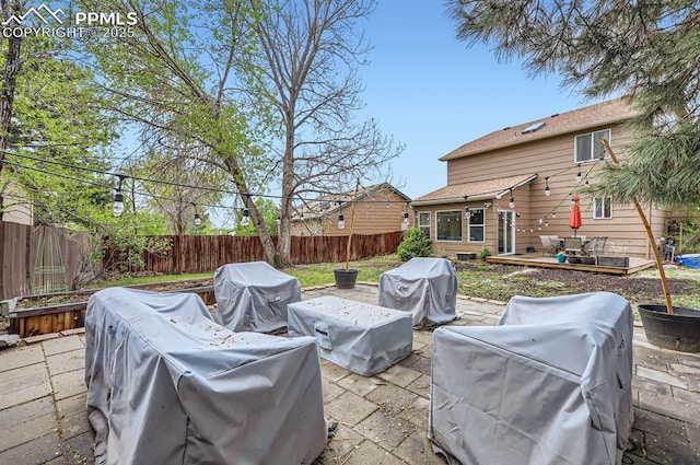 4258 Grassy Ct, Colorado Springs, CO 80916 - view of patio featuring a fenced backyard, a grill, a deck, and an outdoor living space
