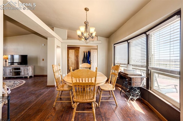 26985 Flower Cir, Simla, CO 80835 - dining room featuring a chandelier, wood-type flooring, baseboards, and vaulted ceiling