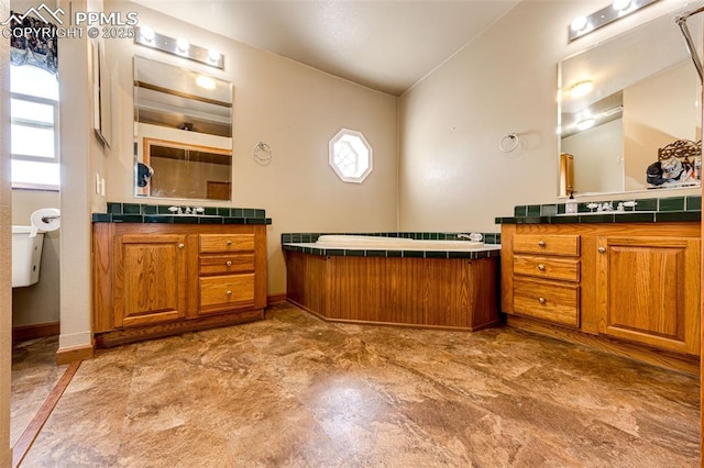 26985 Flower Cir, Simla, CO 80835 - full bathroom featuring two vanities and baseboards