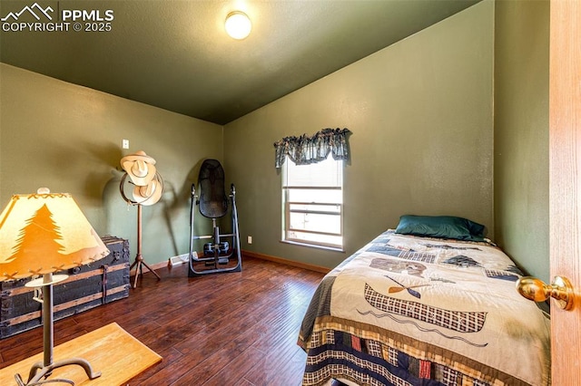 26985 Flower Cir, Simla, CO 80835 - bedroom featuring hardwood / wood-style floors, vaulted ceiling, and baseboards