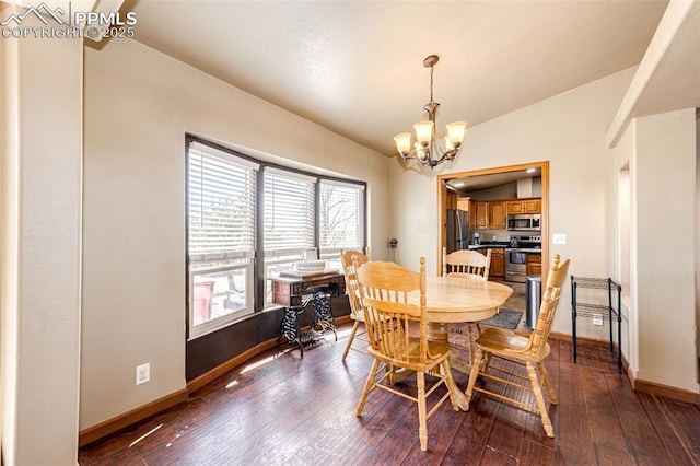 26985 Flower Cir, Simla, CO 80835 - dining space featuring a chandelier, baseboards, dark wood-type flooring, and lofted ceiling