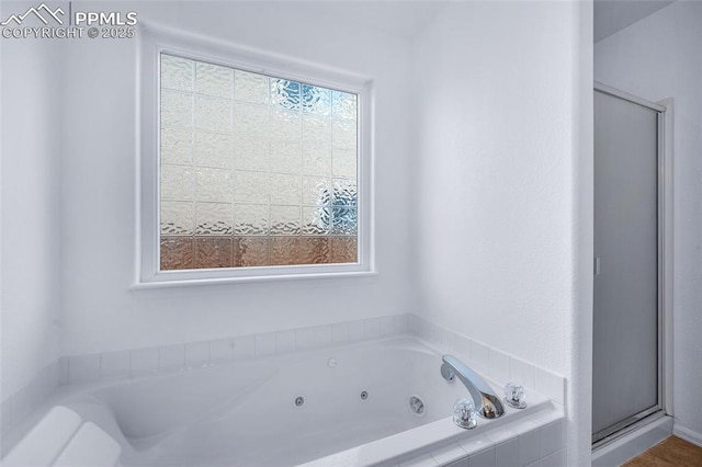 6244 Roundup Butte St, Colorado Springs, CO 80925 - bathroom featuring a stall shower and a jetted tub