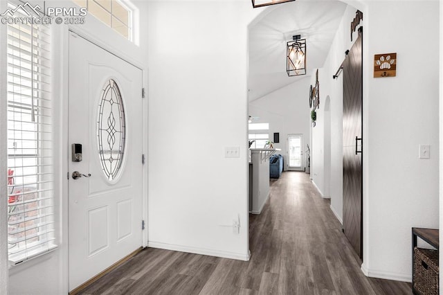 6244 Roundup Butte St, Colorado Springs, CO 80925 - entrance foyer featuring wood finished floors, baseboards, and a high ceiling