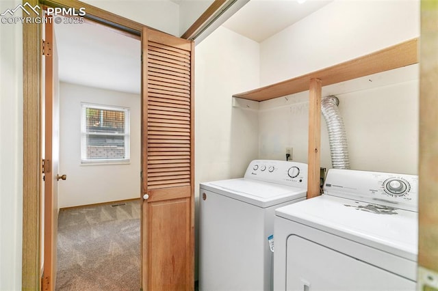 laundry area with washing machine and clothes dryer, carpet, and baseboards