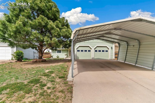 garage with a carport and driveway