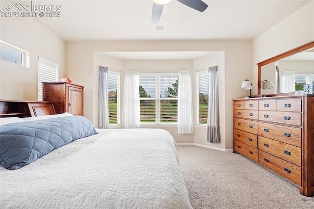carpeted bedroom featuring ceiling fan and baseboards