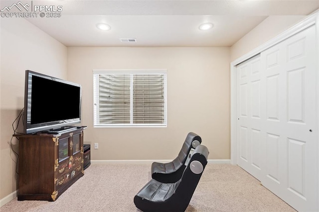 living area with carpet flooring, baseboards, and recessed lighting