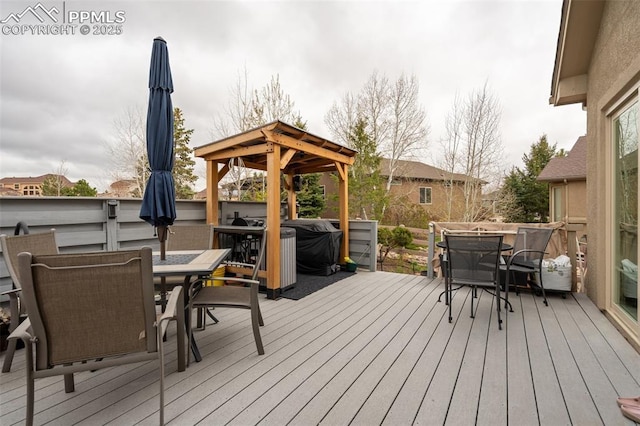 wooden deck with outdoor dining space