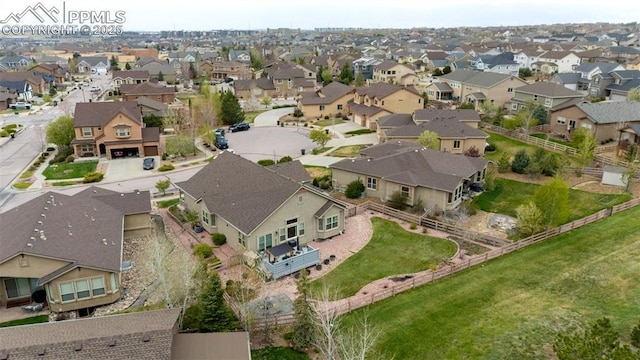 aerial view of property and surrounding area with nearby suburban area