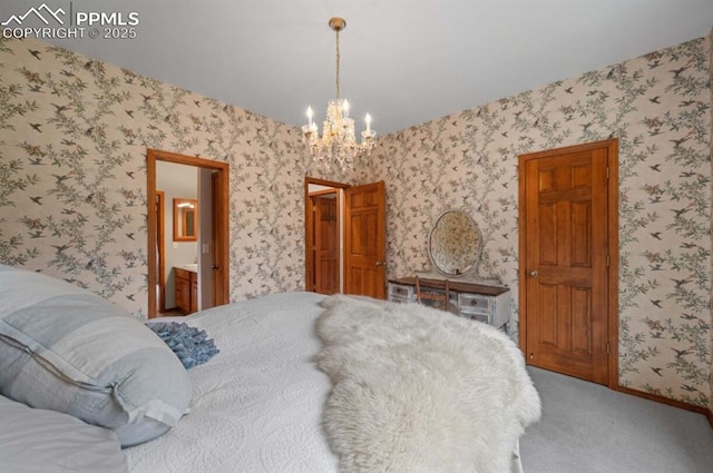 8360 Wranglers Way, Colorado Springs, CO 80908 - carpeted bedroom with a chandelier, wallpapered walls, and ensuite bath