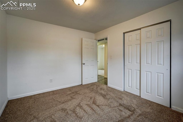 505 2nd Ave, Deer Trail, CO 80105 - unfurnished bedroom with carpet flooring, baseboards, and a closet