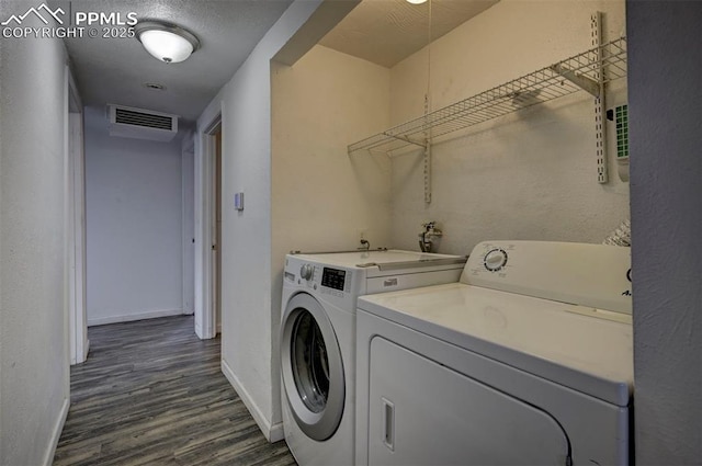 505 2nd Ave, Deer Trail, CO 80105 - clothes washing area featuring independent washer and dryer, baseboards, and dark wood-type flooring