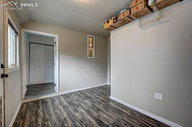 505 2nd Ave, Deer Trail, CO 80105 - empty room with dark wood-style flooring, baseboards, and lofted ceiling