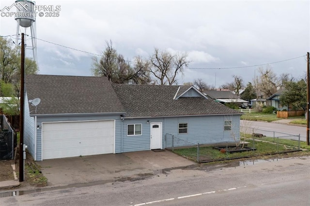 505 2nd Ave, Deer Trail, CO 80105 - garage with fence and driveway