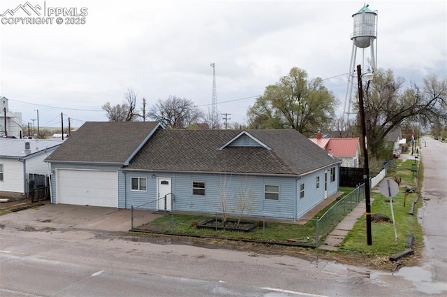 505 2nd Ave, Deer Trail, CO 80105 - view of front of house with a garage, driveway, and roof with shingles