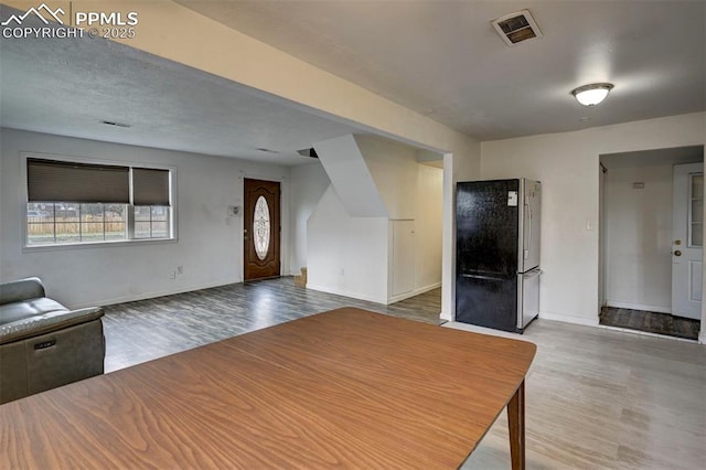 505 2nd Ave, Deer Trail, CO 80105 - unfurnished living room with wood finished floors and baseboards