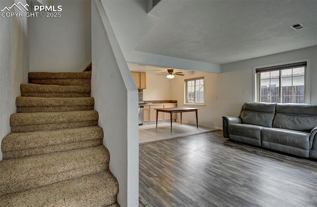 505 2nd Ave, Deer Trail, CO 80105 - stairway with wood finished floors, baseboards, and ceiling fan