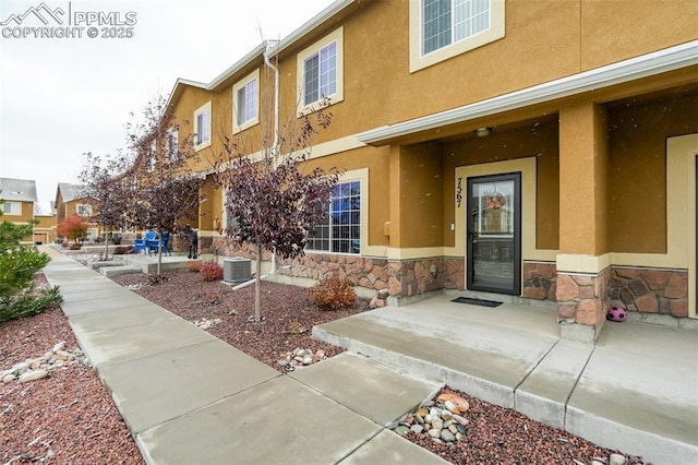 7567 Black Spruce Hts, Colorado Springs, CO 80908 - property entrance with stone siding and stucco siding