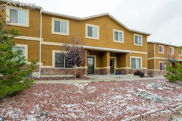 7567 Black Spruce Hts, Colorado Springs, CO 80908 - view of front of property with stone siding and stucco siding