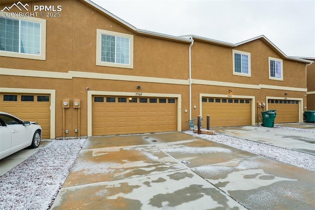 7567 Black Spruce Hts, Colorado Springs, CO 80908 - view of front of property with a garage, driveway, and stucco siding