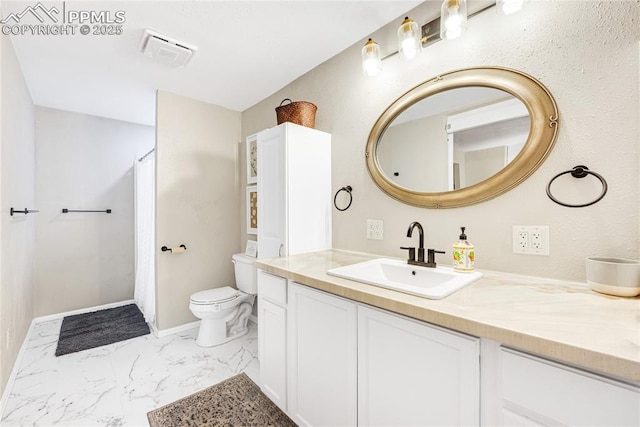 313 E Evans Ave, Pueblo, CO 81004 - bathroom featuring marble look tile flooring, vanity, toilet, baseboards, and a shower