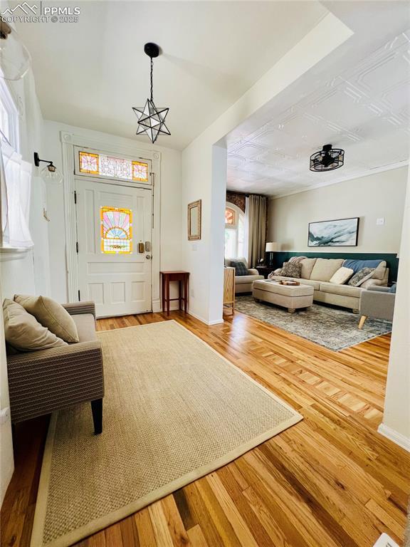 313 E Evans Ave, Pueblo, CO 81004 - living area with wood finished floors and baseboards