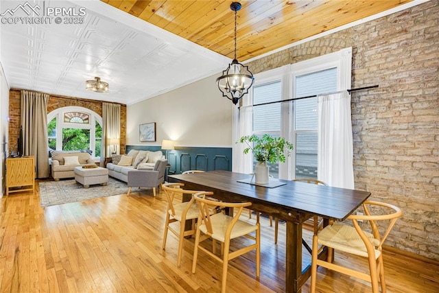313 E Evans Ave, Pueblo, CO 81004 - dining space featuring light wood-style floors, a chandelier, and crown molding