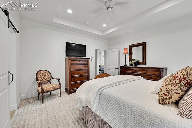 6016 Haster Grv, Colorado Springs, CO 80927 - bedroom featuring a barn door, recessed lighting, baseboards, light colored carpet, and a ceiling fan