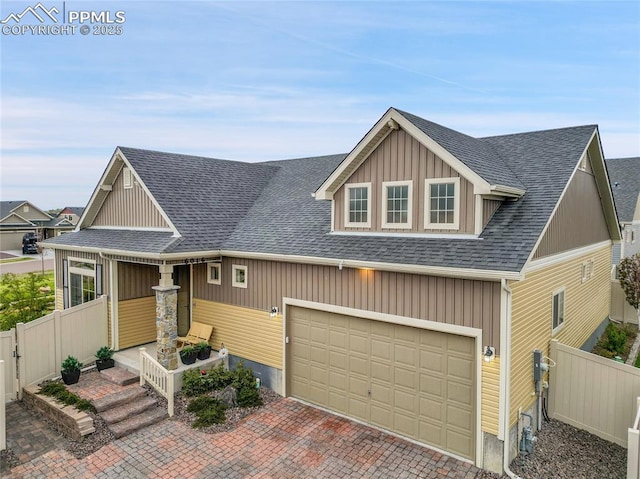 6016 Haster Grv, Colorado Springs, CO 80927 - craftsman-style house featuring fence, a shingled roof, and decorative driveway