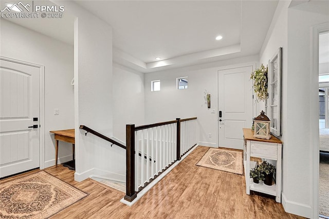 6016 Haster Grv, Colorado Springs, CO 80927 - entryway featuring wood finished floors, a raised ceiling, baseboards, and recessed lighting